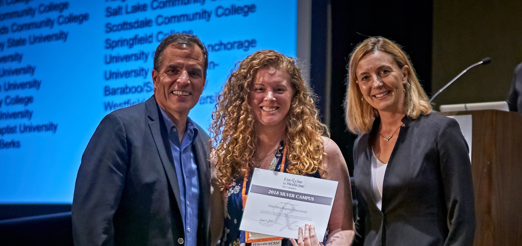 Dr. Amber Chelette, center, accepts Silver Status honors in the Exercise is Medicine® program at the national American College of Sports Medicine Summit.