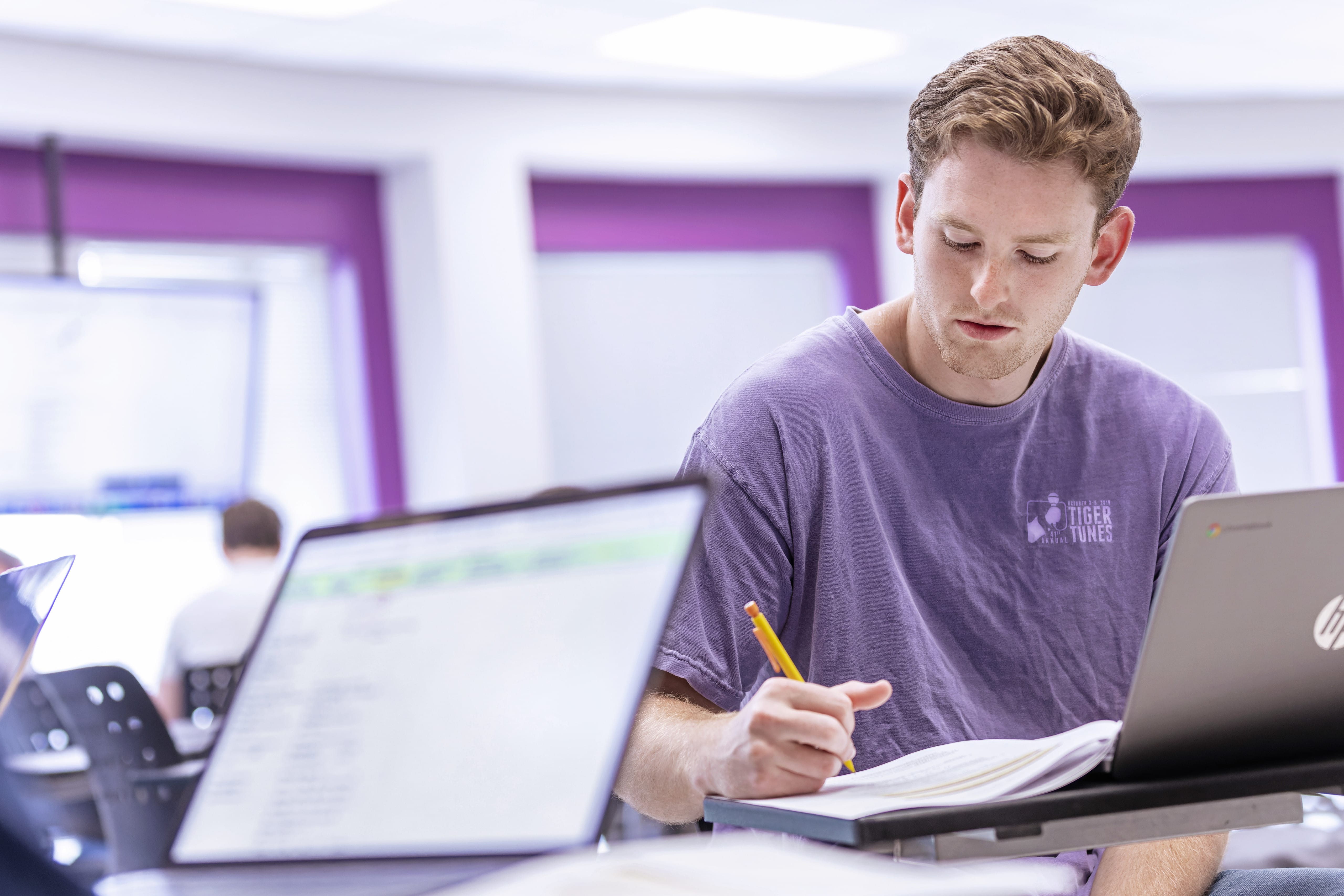 student taking notes